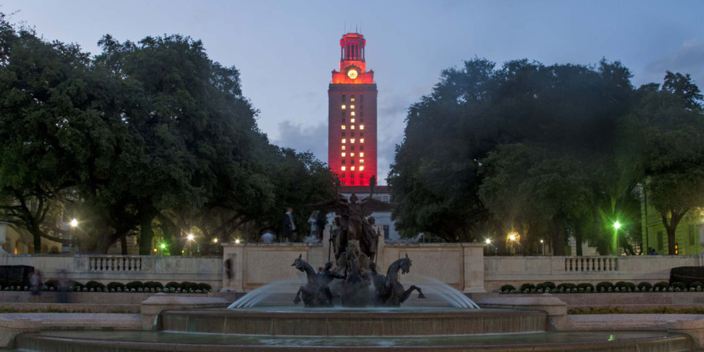UT Tower lighted orange with the number 15 displayed