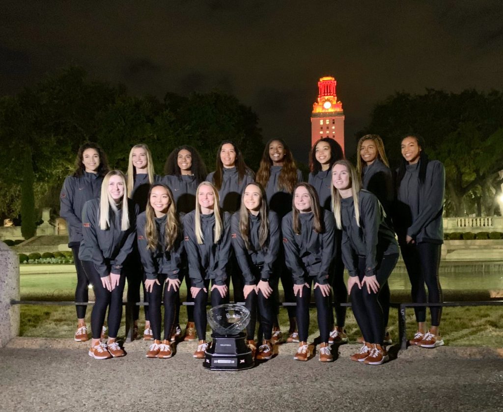 UT Women's volleyball team with trophy.