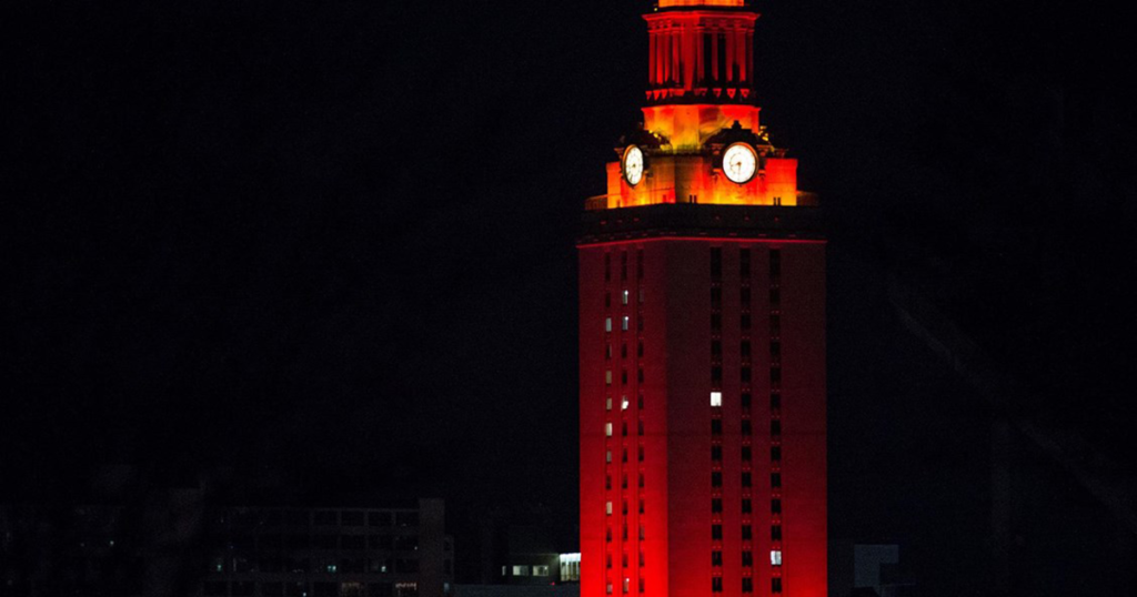 Orange lights shine on the UT Tower