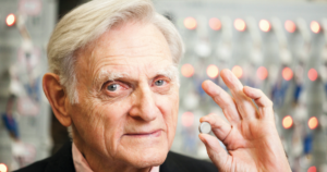 John B. Goodenough, professor in the Cockrell School of Engineering at The University of Texas at Austin, holds a lithium-ion battery, which he helped invent