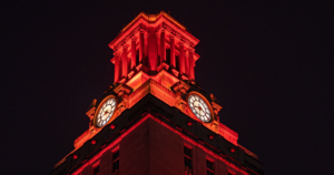 The top of the UT Tower is covered with burnt orange lights