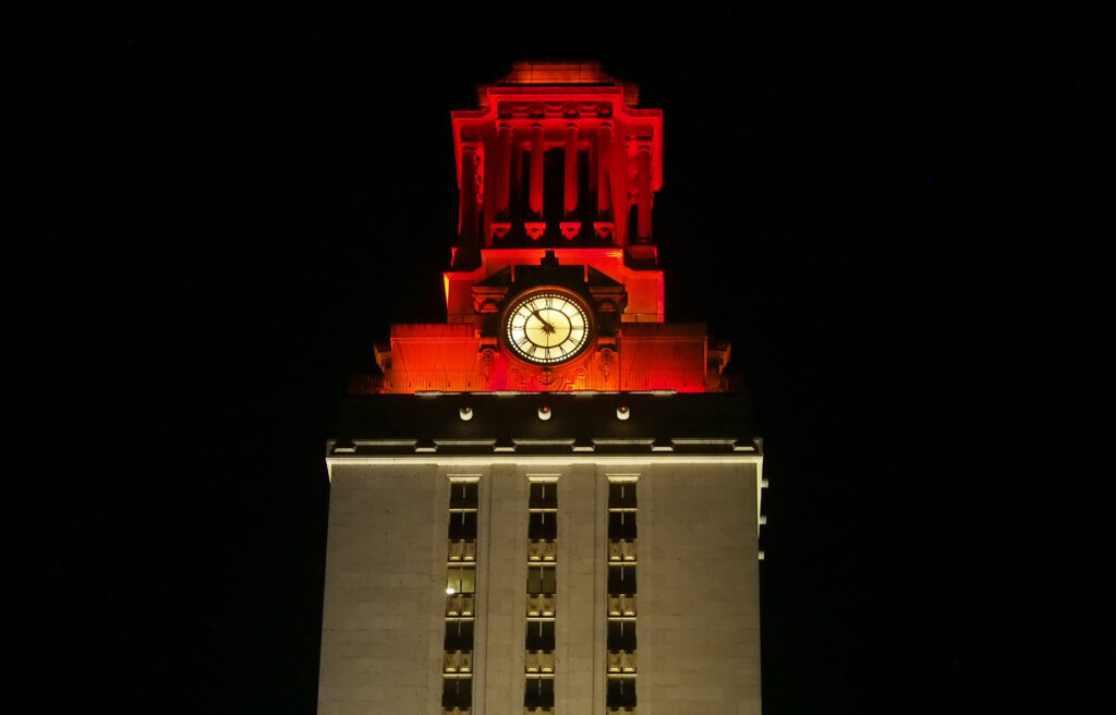 Tower at night with orange top and white shaft 2015