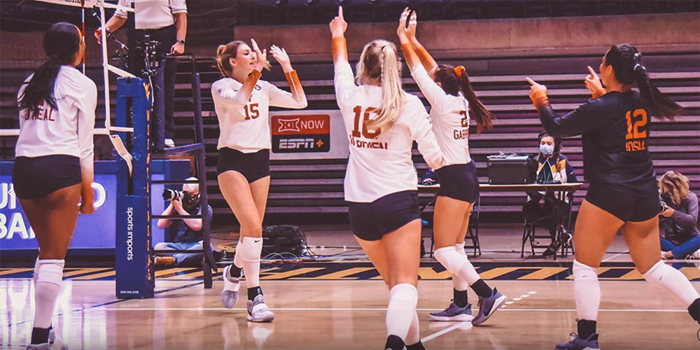 The UT volleyball team celebrates on the court