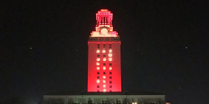 A screenshot of the UT Austin Instagram shows a 2017 picture of the Tower shining with orange lights and "21" on its sides. The Tower was in that special lighting configuration then to welcoming the Class of 2021 to the Forty Acres when they were incoming students.