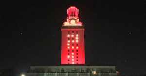 A screenshot of the UT Austin Instagram shows a 2017 picture of the Tower shining with orange lights and "21" on its sides. The Tower was in that special lighting configuration then to welcoming the Class of 2021 to the Forty Acres when they were incoming students.