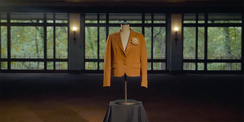 The burnt orange suit jacket given to Texas Exes Distinguished Alumnus Award recipients is worn by a display mannequin with only a chest.