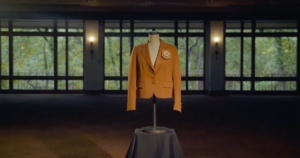 The burnt orange suit jacket given to Texas Exes Distinguished Alumnus Award recipients is worn by a display mannequin with only a chest.