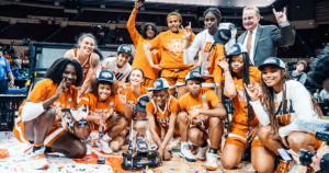 Members of the Texas Women’s Basketball team celebrate and pose for a picture after winning the Big 12 conference title.
