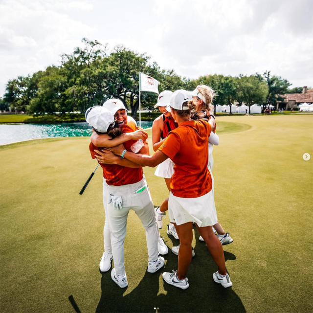 Golfers celebrate on the green