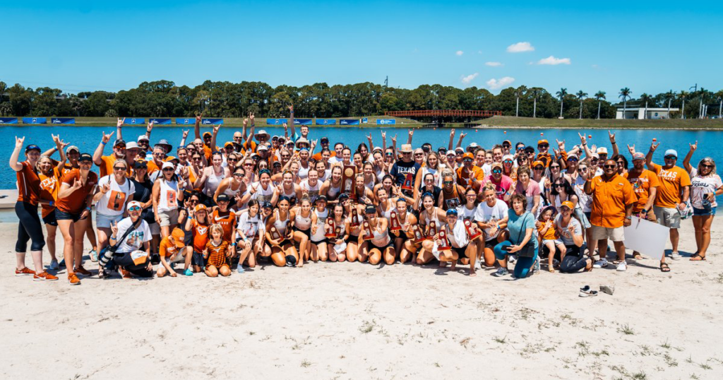 A large group of people including the Texas Rowing team gather for a group photo