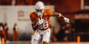 Texas Football player carrying the ball at the UT vs ULM game