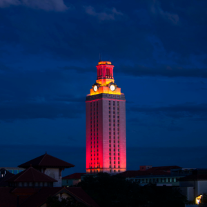 The U.T. Tower shines with burnt orange lights