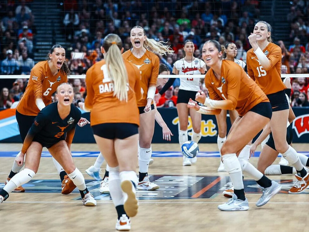Texas Volleyball players celebrate on the court