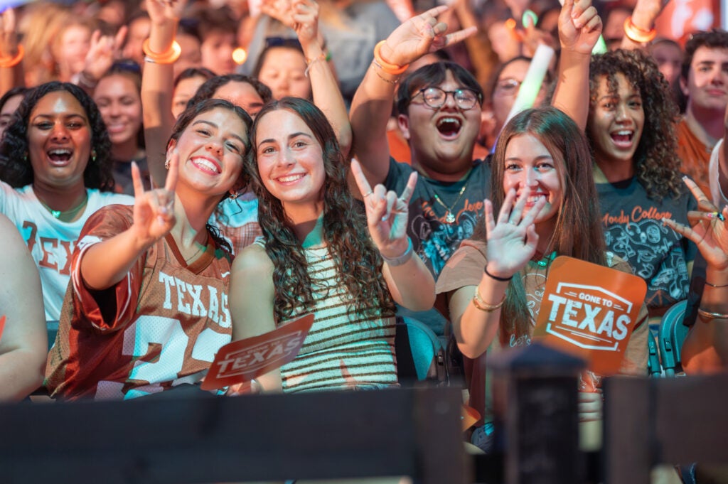 Students cheering at the annual Gone to Texas event at The University of Texas at Austin.